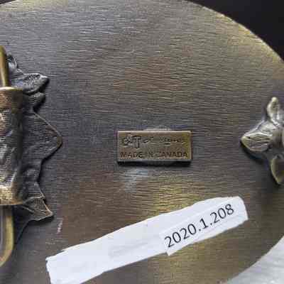 [Belt Buckle] Blackburn Water Hauling, Antique-Bronze - Maker's Mark: Close-up view of the maker's mark on the back.