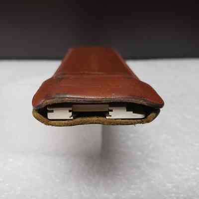 [Slide Rule] Union Carbide Chemicals and Plastics, White Plastic, Brown Leather - Opening Case: View of case opening with slide rule inside.