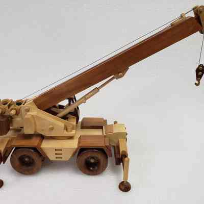 Left-side view, partially lowered crane arm