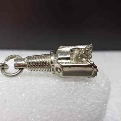 [Keychain] Macbernal Recyling Systems Ltd., Drill Head, Silver - Side, Drill: View from the side of the drill head attachment.