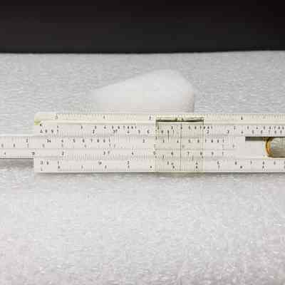 [Slide Rule] Union Carbide Chemicals and Plastics, White Plastic, Brown Leather - Front Slide Rule, Extended: Front view of slide rule, extended