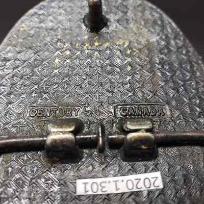 [Belt Buckle] Champion Northwestern Chemicals Ltd., Antique-Bronze - Maker's Mark: Close-up view of the maker's mark on the back.
