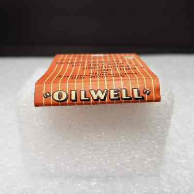 [Matchbook] Oil Well Supply Co., 20-strike, Orange Black White - Saddle: View of saddle