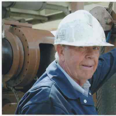 [Photo] Don Hunter, In Blue Overalls and White Helmet, Colour, 4x6in