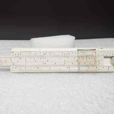 [Slide Rule] Dominion Bridge Co. Ltd./Riverside Iron & Engineering Works Ltd., White Plastic, Brown Leather - Front Slide Rule, Extended: Front view of slide rule, extended
