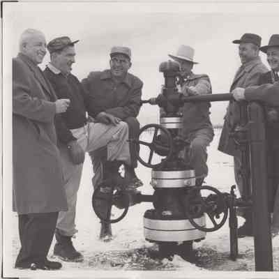[Photo] Group of Seven Men around a Christmas Tree Valve, B&W, 8x10in