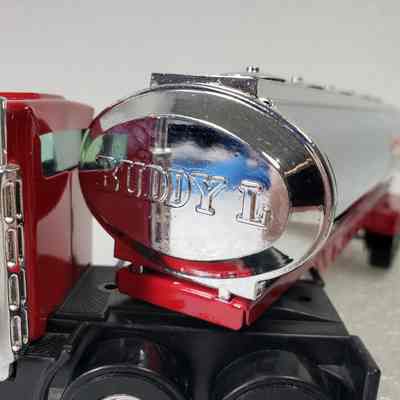 Close-up, truck cab back and tanker front angled, right side