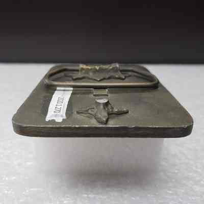 [Belt Buckle] Carnohan Enterprises Inc., Oilfield Construction, Antique-Bronze Orange Black [Broken] - Hook: Close-up view of the broken hook.