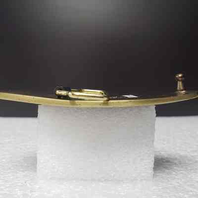 [Belt Buckle] Artie T. Kos Trucking Ltd., Bronze - Side: View from side.