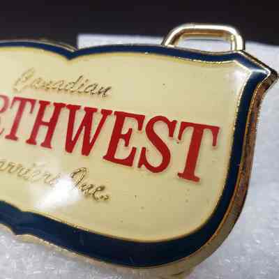 [Belt Buckle] Canadian Northwest Carrier Inc., Gold Enamel - Front, Right: Close-up view of the front, right.