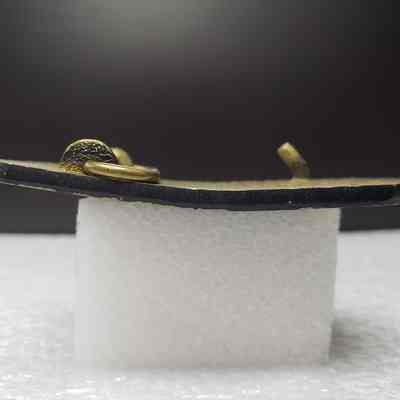 [Belt Buckle] Champion Chemicals Inc., Brass Black - Side: View from the side.