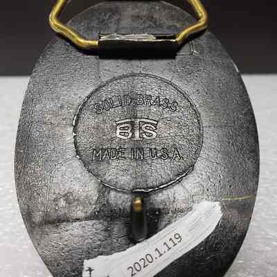 [Belt Buckle] Academy Electric Ltd. Oilfield Services, Bronze - Maker's Mark: Close-up view of maker's mark on back.