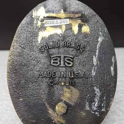 [Belt Buckle] Canadian Fluid Systems Ltd., Antique-Bronze [Damaged] - Maker's Mark: View of the maker's mark on the back.
