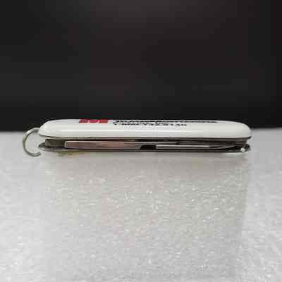 [Pocket Knife] TransMontaigne Pipeline Inc., White Red - Bottom: View of bottom edge with scissors