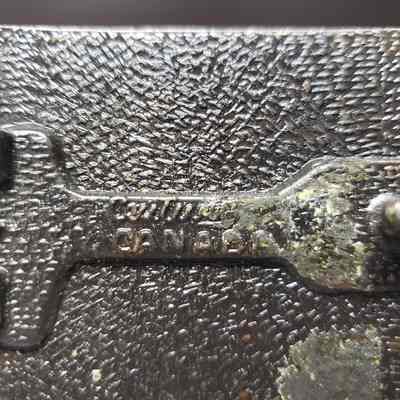 [Belt Buckle] CEDA, Antique-Bronze - Maker's Mark: Close-up view of the maker's mark on the back.
