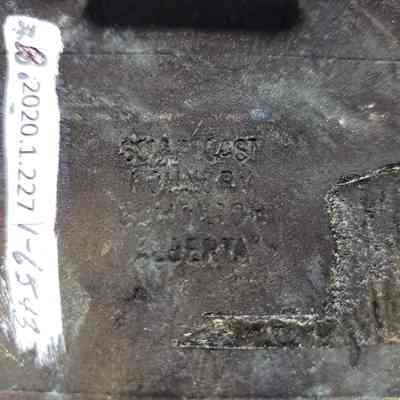 Bow Island Drilling, One Year Service, Antique-Bronze - Maker's Mark: Close-up view of the maker's mark on the back.