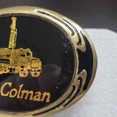 [Belt Buckle] Bill McColman, Black Gold Bronze - Front, Right: Close-up angled view of the right-side of the front.