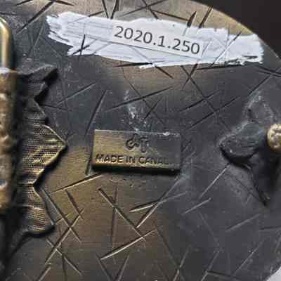 [Belt Buckle] Canadian Superior, Antique-Bronze Blue - Maker's Mark: Close-up view of the maker's mark on the back.