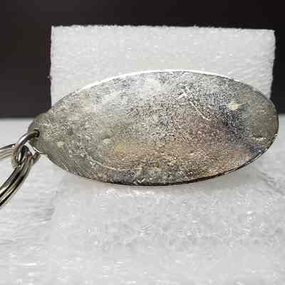 [Keychain] Macbernal Recyling Systems Ltd., Drill Head, Silver - Back, Oval Fob: Close-up view of the back of the oval fob.