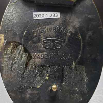 [Belt Buckle] Brelco Drilling Ltd., Antique-Bronze - Maker's Mark: Close-up view of the maker's mark on the back.