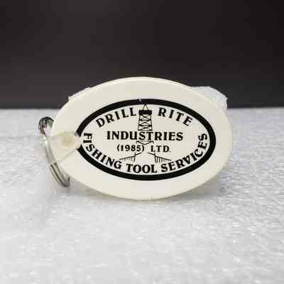 [Keychain] Drill Rite Industries Ltd. Fishing Tool Services, 1985, White
