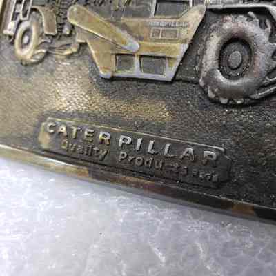 [Belt Buckle] Caterpillar Quality Products Reg'd, Bowl Scraper, Antique-Bronze - Front, Close-Up: Close-up view of the text on the front.