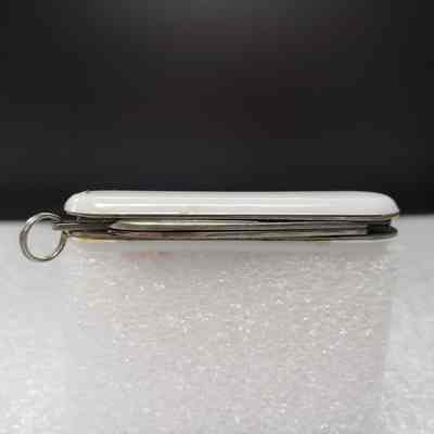 [Pocket Knife] TransMontaigne Pipeline Inc., White Red - Top: View of top edge with file and knife