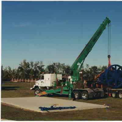 [Photo] Installation of Hardware below Leduc #1 Replica, Leduc #1 Energy Discovery Centre, Colour, 4x6in