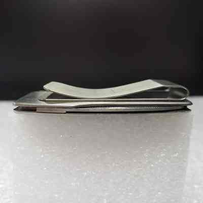 [Pocket Knife] Westcamp Catering Ltd, Money Clip, 1981 - Bottom Edge: View of bottom edge with file.