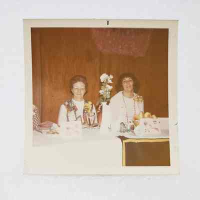 [Photo] Two Ladies Seated at White Table, Association of Desk and Derrick Clubs, Square, White Border, c.1972