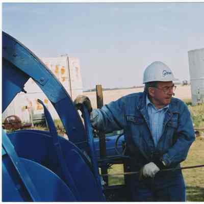 [Photo] Man Setting-Up Wooden Cable Rig, Leduc #1 Energy Discovery Centre, Colour, 4x6in