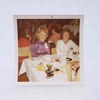 [Photo] Two Ladies Seated at Dining Table, Association of Desk and Derrick Clubs, Square, White Border, c.1972