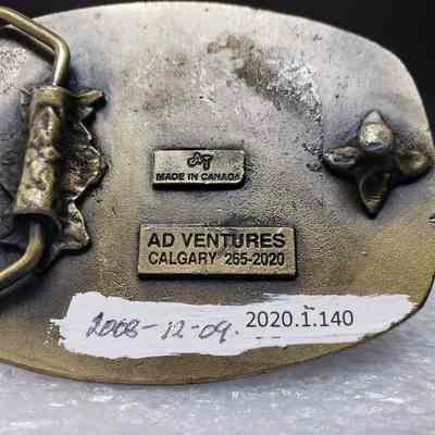 [Belt Buckle] Alta Flights, Bronze - Maker's Mark: Close-up view of maker's mark on back.