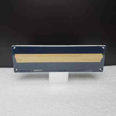 [Desk Plaque] Ticker Tape, "AMEX WELCOMES WESTBURNE...", Acrylic - Front: View of front.