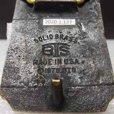 [Belt Buckle] Alberta Perforators Inc., Bronze - Maker's Mark: Close-up view of maker's mark on back.