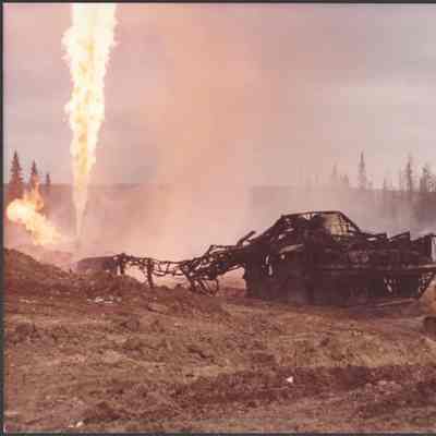 [Photo] Burnt Framework with Large Flare and Bulldozer in Foreground, 1960s-1980s, 354mm x 279mm