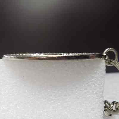 [Keychain] Macbernal Recyling Systems Ltd., Drill Head, Silver - Side, Oval Fob: View from side of oval fob.