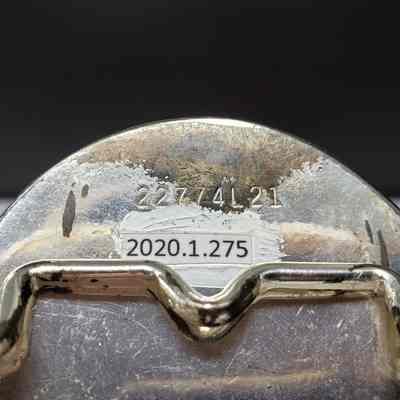 [Belt Buckle] CAT, Ornate, Silver - Maker's Mark, Hinge: Close-up view of the maker's mark above the hinge.