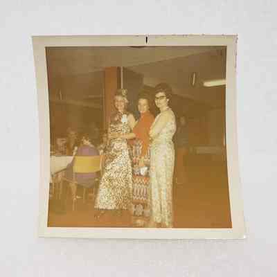 [Photo] Three Formally Dressed Ladies Posing in a Dining Hall, Association of Desk and Derrick Clubs, Square, White Border, c.1972