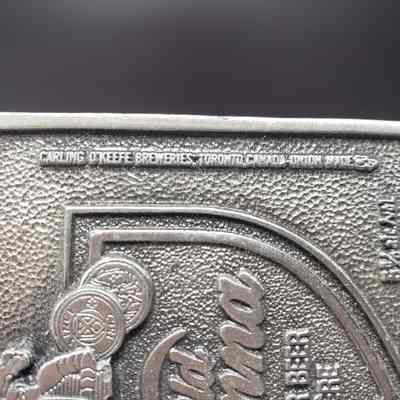 Belt Buckle] Old Vienna Lager, 1978 - Close-Up Right Text: Close-up view of vertical text on right for front