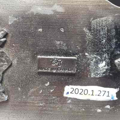 [Belt Buckle] Carnwood Wire Line Service Ltd., Antique-Silver - Maker's Mark: Close-up view of the maker's mark on the back.
