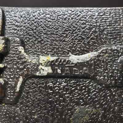 [Belt Buckle] CEDA, Antique-Bronze - Maker's Mark: Close-up view of the maker's mark on the back.