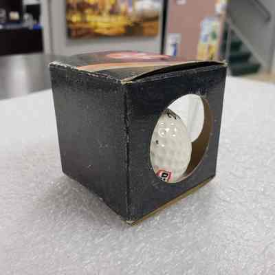 [Golf Ball] Texaco, w/ Box - Ball in Box, Right Side: View of box with Ball inside, angles to show back and right side.
