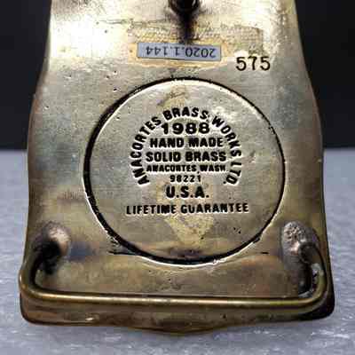 [Belt Buckle] Amoco Canada - Dome Petroleum Merger, 1988, Bronze - Maker's Mark: View of maker's mark on back.