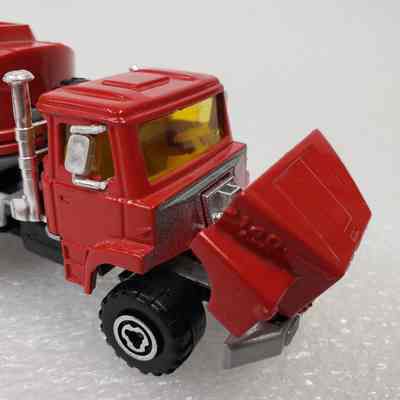 Close-up, front-left truck cab, bonnet opened