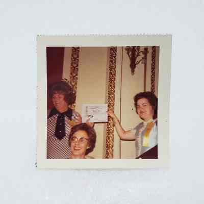 [Photo] Three Ladies with Two Holding 'Program of the Year's Award, Association of Desk and Derrick Clubs, Small, Square, White Border, c.1972