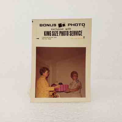 [Photo]Two Ladies with a Pink an Blue Wrapped Gift, "Bonus Photo" Print, Association of Desk and Derrick Clubs, Square, White Border, c.1972