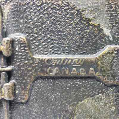 [Belt Buckle] B&R Transport Ltd., Leather Antique-Bronze - Maker's Mark: Close-up view of the maker's mark on the back.