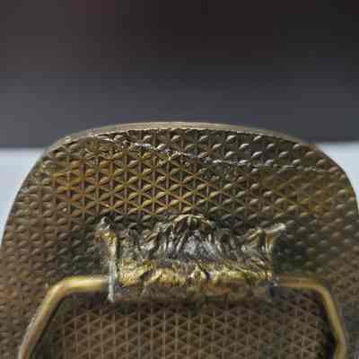 Close-up of deep scratch across back, left.