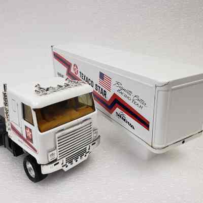 Front view, left-angle, separated truck and trailer side-by-side.